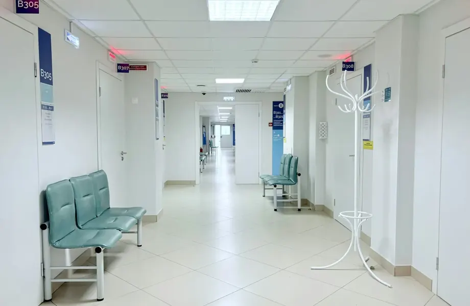 Clean hospital corridor with waiting chairs