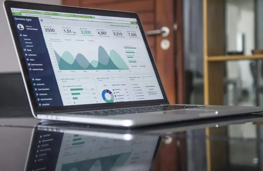 Laptop showing a marketing analytics dashboard with charts