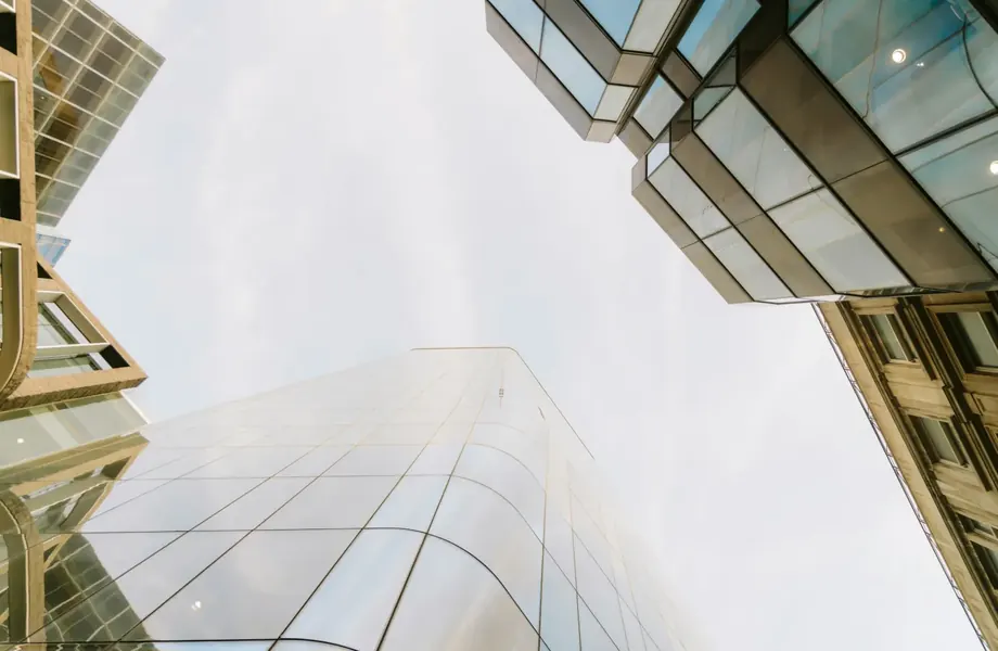 Glass office towers seen from street level looking up