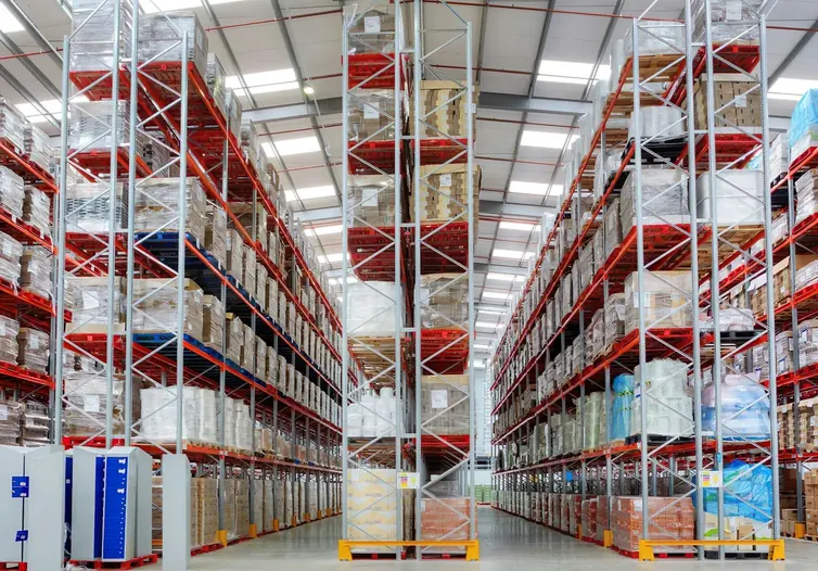 Tall warehouse racking stocked with palletized goods