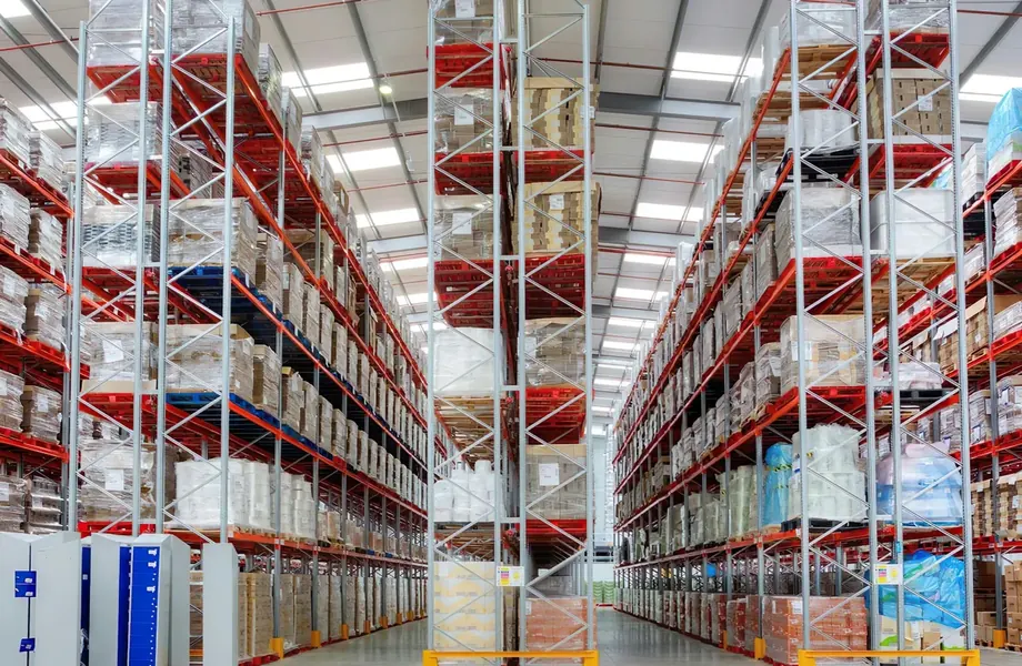 Tall warehouse racking stocked with palletized goods